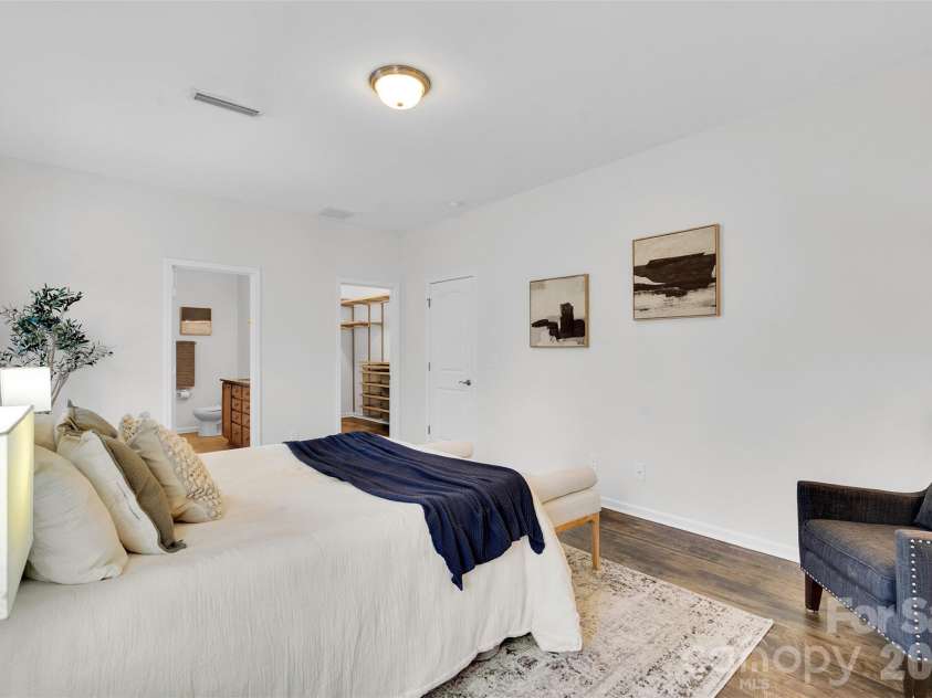 8214 Aspen Court, Charlotte, NC 28227.  MLS# CAR4272999, YatesRealty ID 29302. Main floor primary bedroom with custom walk in closet.