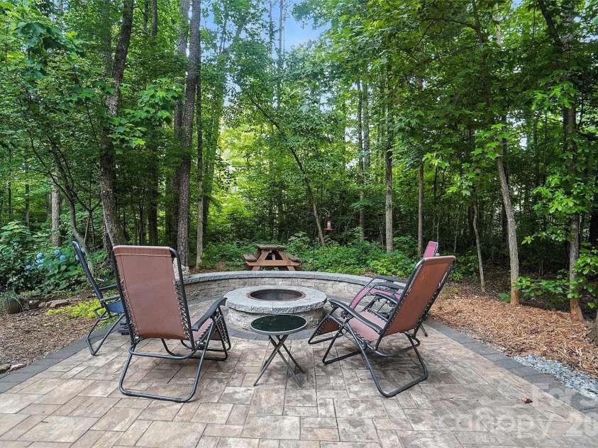 8214 Aspen Court, Charlotte, NC 28227.  MLS# CAR4272999, YatesRealty ID 29302. Paver patio with firepit