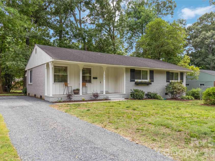 3526 Stonehaven Drive, Charlotte, NC 28215.  MLS# CAR4391236, YatesRealty ID 29308. Front exterior-side angle with driveway