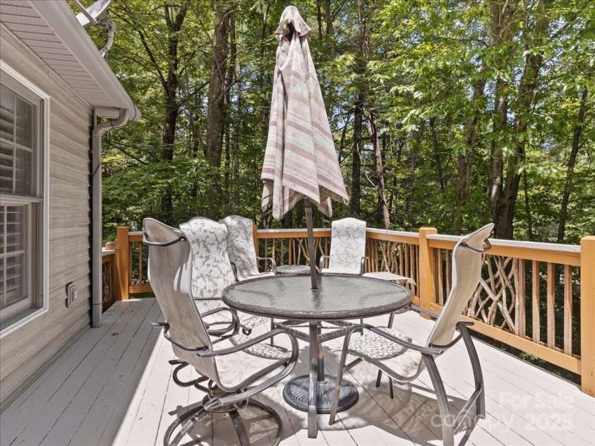 23 Dvga Court, Brevard, NC 28712.  MLS# CAR4285839, YatesRealty ID 29322. Deck off Primary and Sunroom