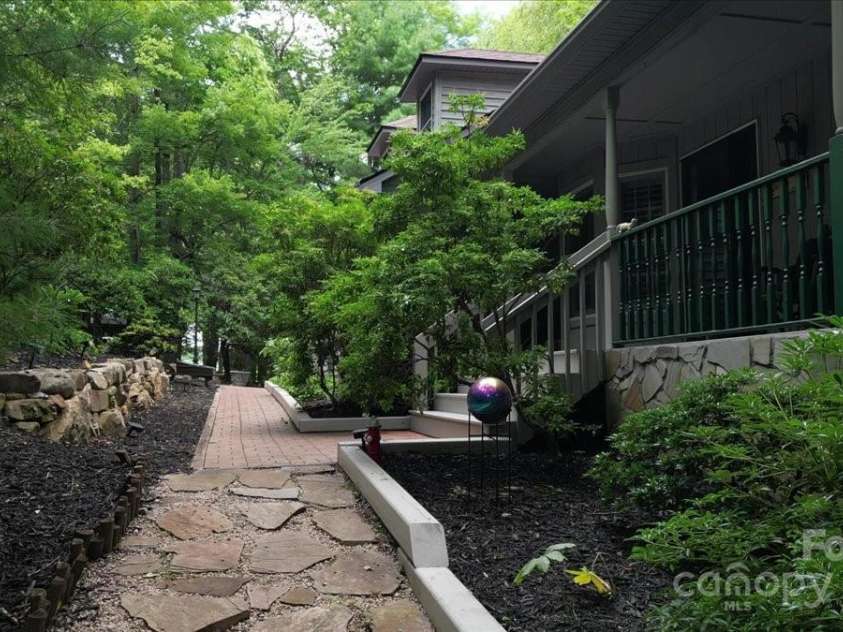 23 Dvga Court, Brevard, NC 28712.  MLS# CAR4285839, YatesRealty ID 29322. Walkway to side yard