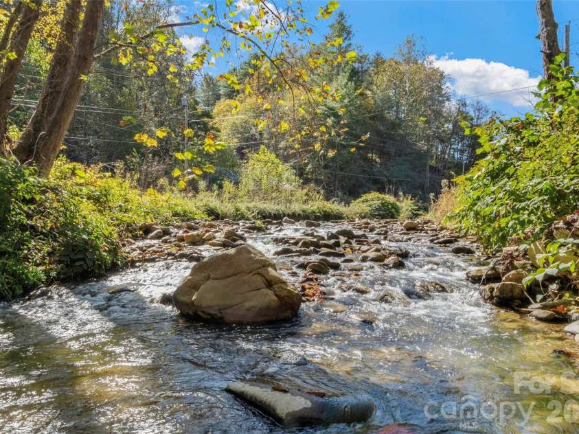 689 Bald Mountain Road, Burnsville, NC 28714.  MLS# CAR4309436, YatesRealty ID 2933. Bald Mountain Creek