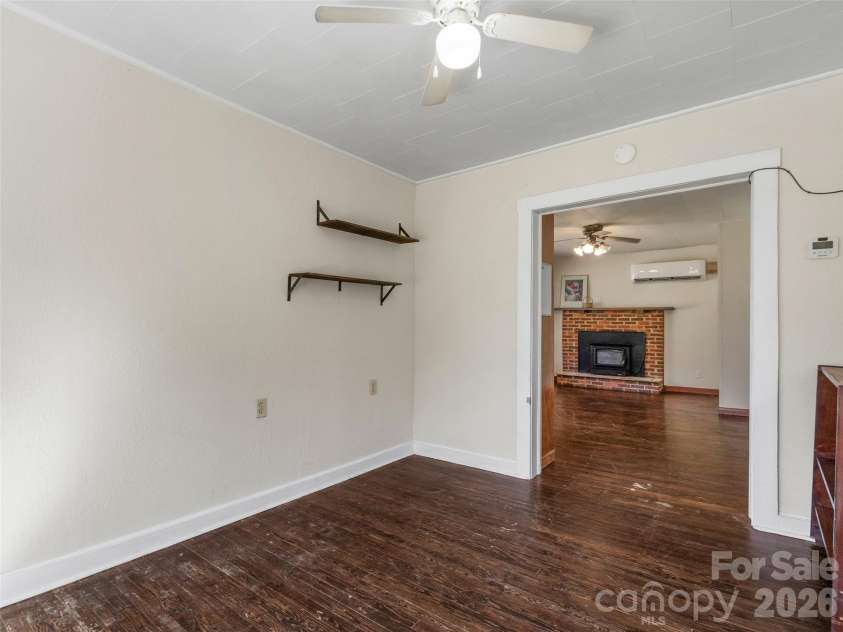 689 Bald Mountain Road, Burnsville, NC 28714.  MLS# CAR4309436, YatesRealty ID 2933. Dining Room into Living Room