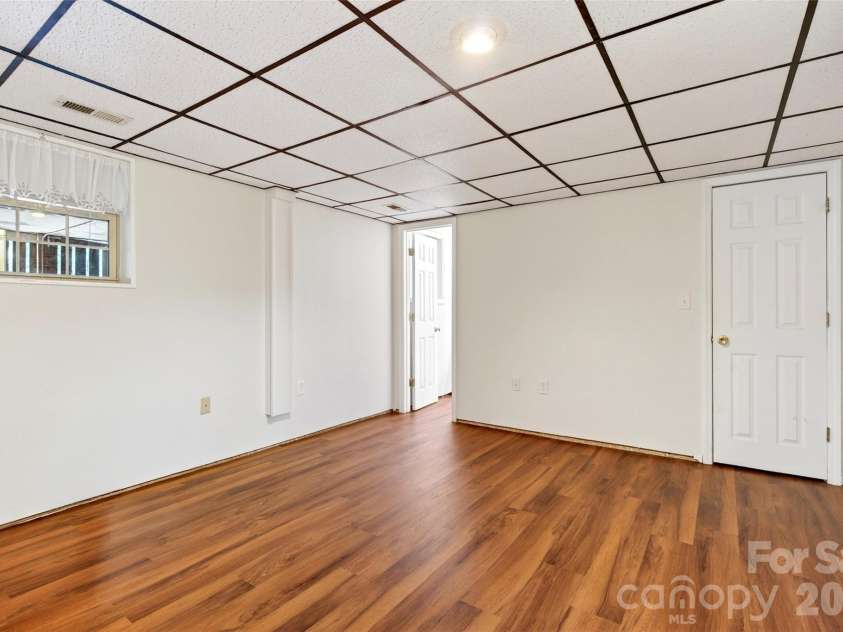 104 Valley Vista Drive, Black Mountain, NC 28711.  MLS# CAR4388162, YatesRealty ID 29333. Flex space could be used as a bedroom, has lower ceiling height.
