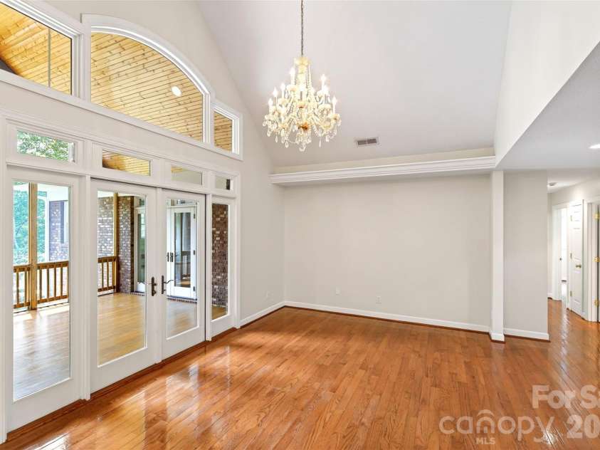104 Valley Vista Drive, Black Mountain, NC 28711.  MLS# CAR4388162, YatesRealty ID 29333. Living room leads out to vaulted sun porch.
