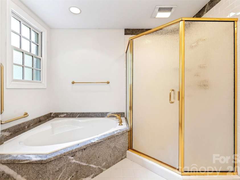 104 Valley Vista Drive, Black Mountain, NC 28711.  MLS# CAR4388162, YatesRealty ID 29333. Separate soaking tub and shower in primary bath