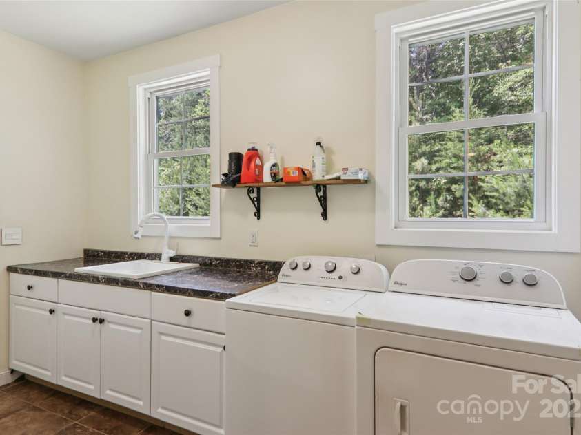 398 Falling Leaves Lane, Hendersonville, NC 28792.  MLS# CAR4267350, YatesRealty ID 29335. Mudroom / Laundry Room with storage closets