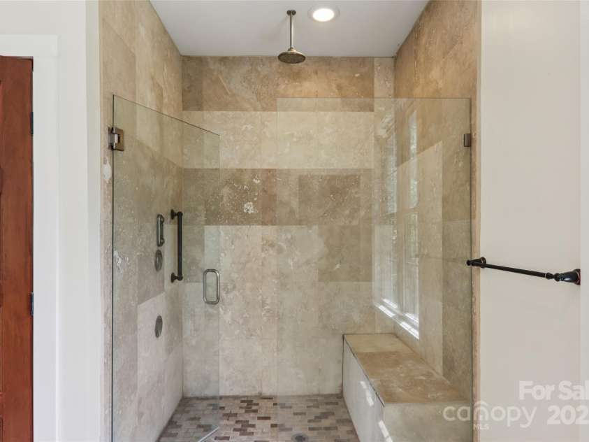 398 Falling Leaves Lane, Hendersonville, NC 28792.  MLS# CAR4267350, YatesRealty ID 29335. Primary bathroom with tiled walk-in shower