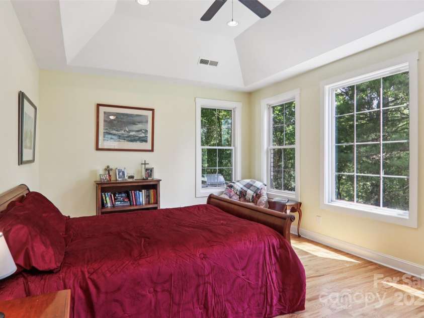 398 Falling Leaves Lane, Hendersonville, NC 28792.  MLS# CAR4267350, YatesRealty ID 29335. Primary bedroom with expanse of windows
