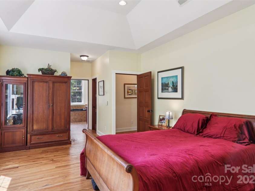 398 Falling Leaves Lane, Hendersonville, NC 28792.  MLS# CAR4267350, YatesRealty ID 29335. Primary bedroom with tray ceiling
