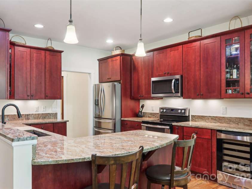 398 Falling Leaves Lane, Hendersonville, NC 28792.  MLS# CAR4267350, YatesRealty ID 29335. SS Appliances - double oven, wine refrigerator