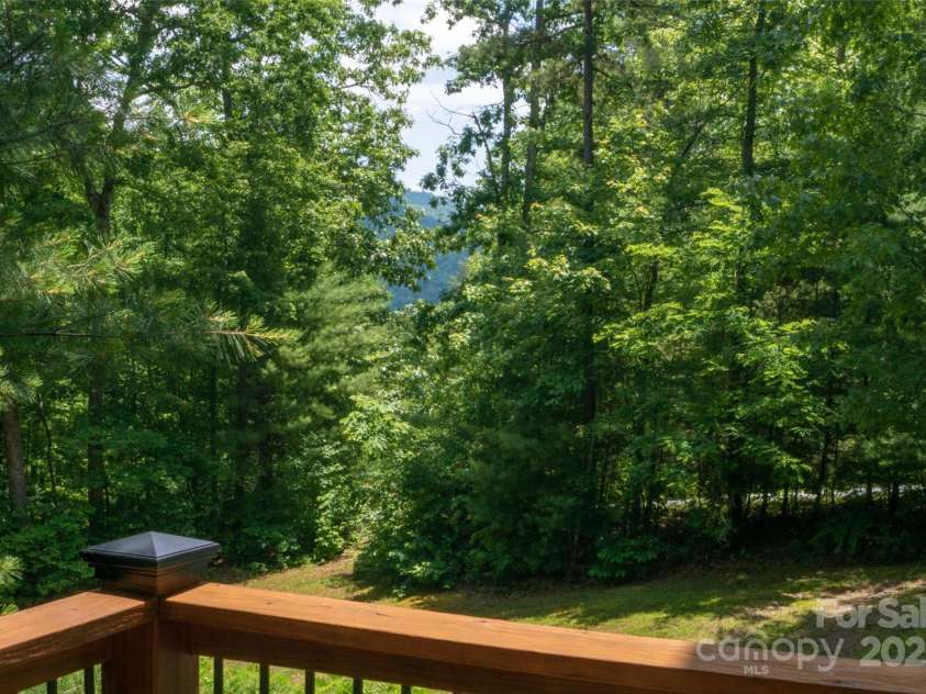 398 Falling Leaves Lane, Hendersonville, NC 28792.  MLS# CAR4267350, YatesRealty ID 29335. Summer View from Deck with Winter Views Opened up