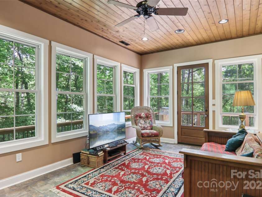 398 Falling Leaves Lane, Hendersonville, NC 28792.  MLS# CAR4267350, YatesRealty ID 29335. Sunroom with access to open wrap around deck