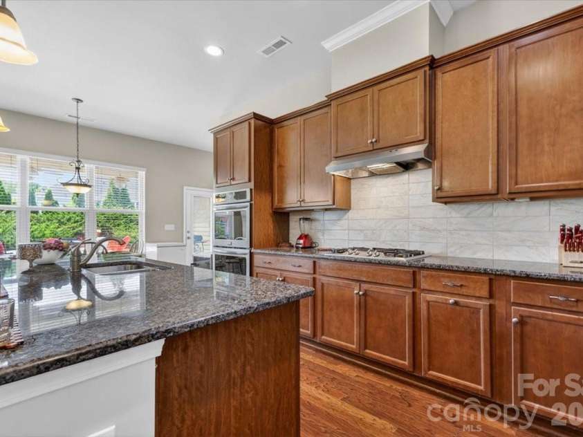 10585 Sweethaven Lane, Harrisburg, NC 28075.  MLS# CAR4356507, YatesRealty ID 29338. Another angle view of the kitchen.