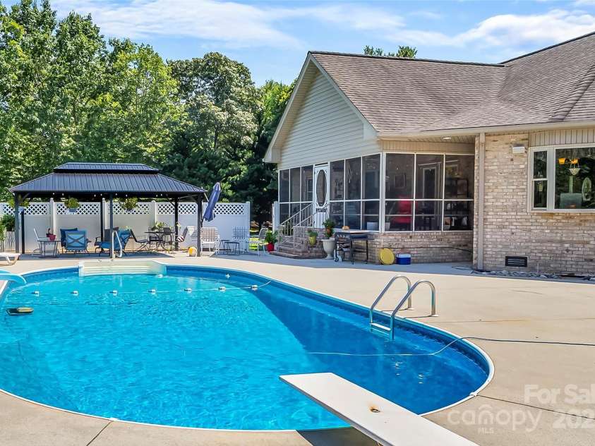 142 Windsor Drive, Taylorsville, NC 28681.  MLS# CAR4283783, YatesRealty ID 29339. Fantastic Outdoor Living Space with Pool, Cabana/Gazebo, and Screened Porch