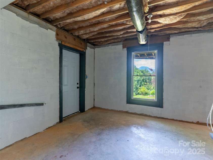 81 Garnet Drive, Leicester, NC 28748.  MLS# CAR4281665, YatesRealty ID 29343. Back Ent into basement