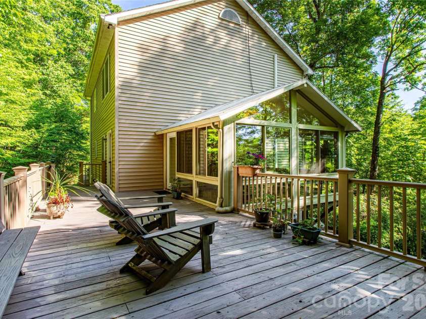 22 Great Aspen Way, Black Mountain, NC 28711.  MLS# CAR4388934, YatesRealty ID 29345. Built in seating on your entertainment deck overlooking the mountains.