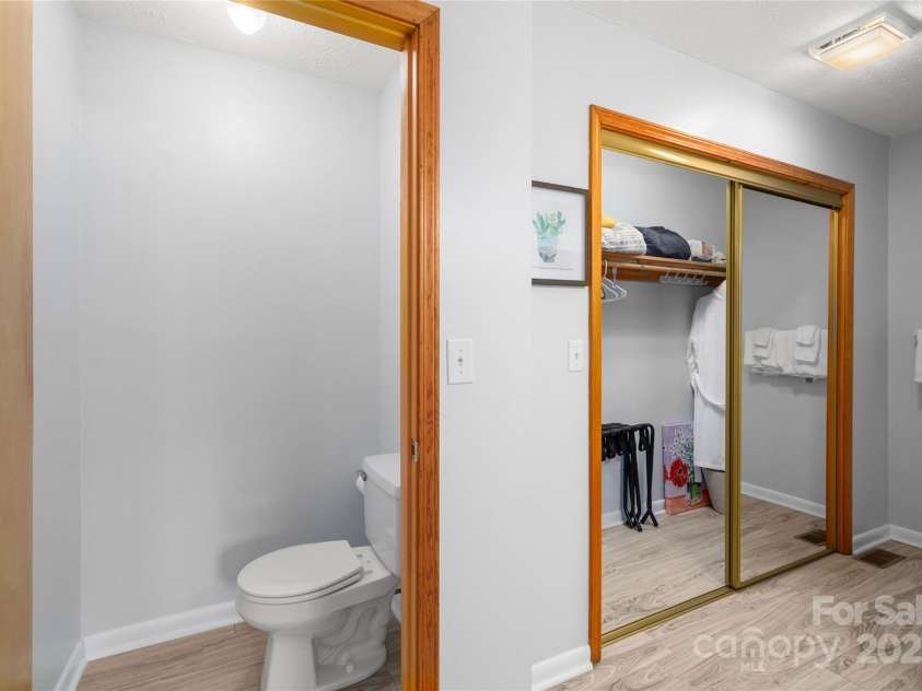 262 Lewis Lane, Maggie Valley, NC 28751.  MLS# CAR4265757, YatesRealty ID 29347. Toilet closet and clothing closet