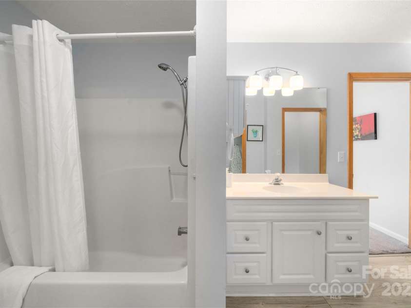 262 Lewis Lane, Maggie Valley, NC 28751.  MLS# CAR4265757, YatesRealty ID 29347. Tub shower and sink