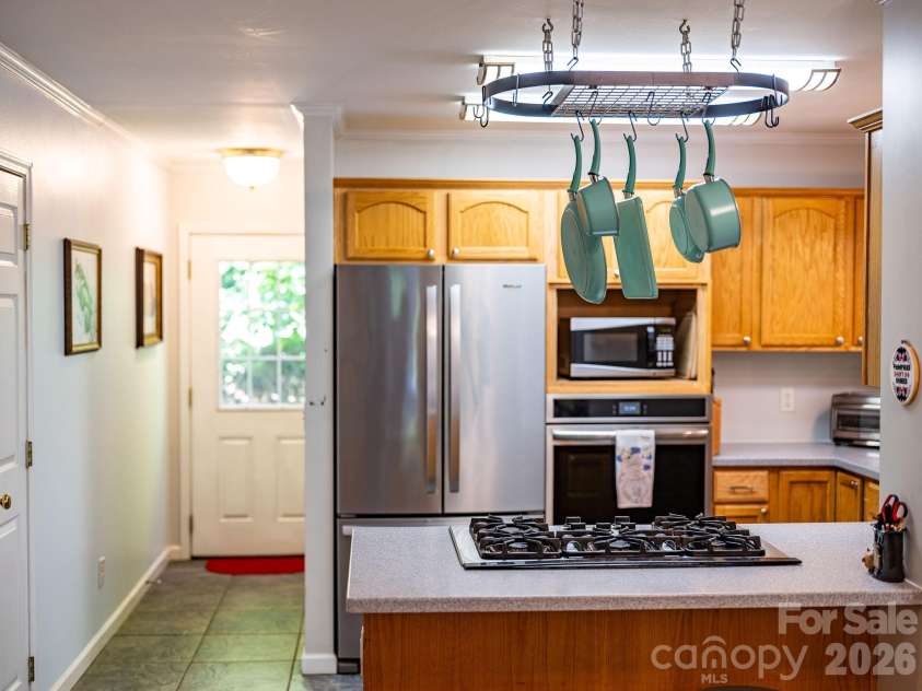 174 deep woods Trail, Canton, NC 28716.  MLS# CAR4378961, YatesRealty ID 29357. Back door, half bath and laundry are beyond the kitchen. 