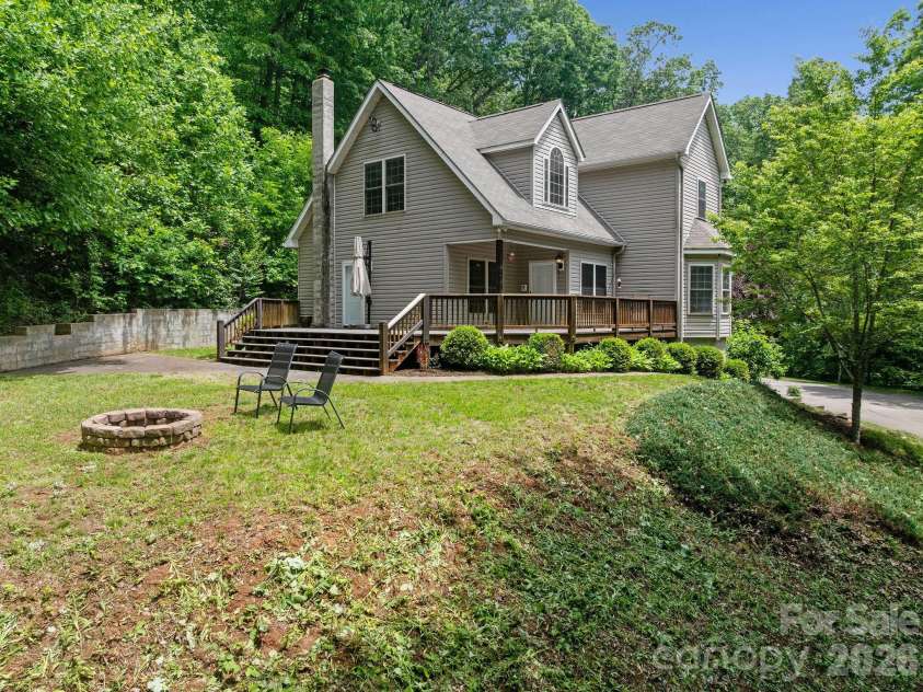 174 deep woods Trail, Canton, NC 28716.  MLS# CAR4378961, YatesRealty ID 29357. Flat side yard and view of house.