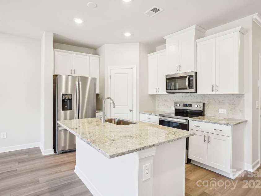 238 Tiger Lily Drive, Fort Mill, SC 29708.  MLS# CAR4277142, YatesRealty ID 29359. Photo is not of the actual home but is an inspirational photo of builder’s model home and may depict options, furnishings, and/or decorator features that are not included.