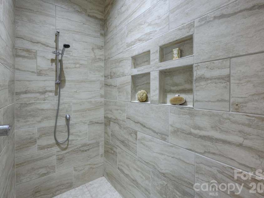 123 Lakefront Drive, Mooresville, NC 28117.  MLS# CAR4368701, YatesRealty ID 29365. Fully tiled, walk-in shower.
