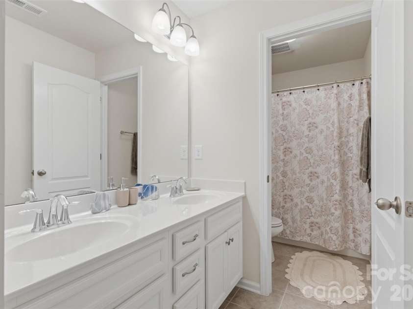 858 Spelman Drive, Indian Land, SC 29707.  MLS# CAR4373142, YatesRealty ID 29372. Hall bathroom with double vanity