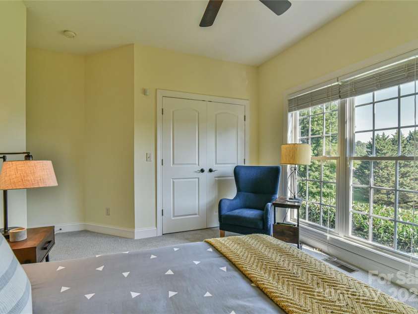 110 Michael Court, Leicester, NC 28748.  MLS# CAR4283846, YatesRealty ID 29373. Bedroom #2 located on the main level facing the front of the home.