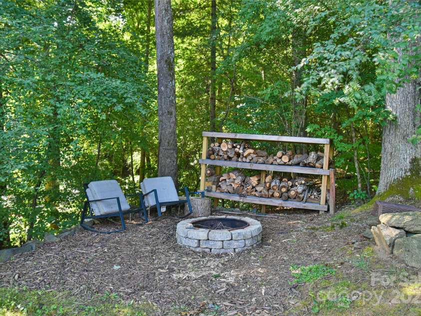 110 Michael Court, Leicester, NC 28748.  MLS# CAR4283846, YatesRealty ID 29373. Fire pit is located just next to the entertaining deck