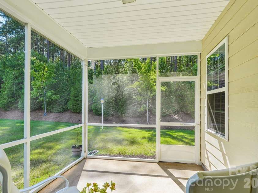 128 Van Gogh Trail, Mount Holly, NC 28120.  MLS# CAR4387655, YatesRealty ID 29376. Covered and screened in porch can be converted to a three season room