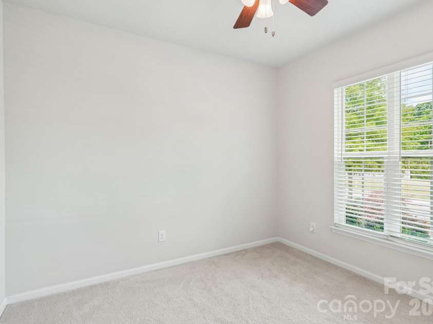 128 Van Gogh Trail, Mount Holly, NC 28120.  MLS# CAR4387655, YatesRealty ID 29376. Front guest room can accomodate a queen sized bed. See next photo for virtual staging..