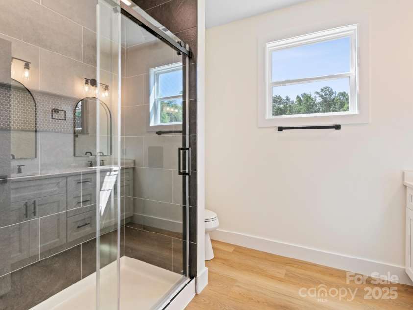 169 Vineyard Village Drive, Old Fort, NC 28762.  MLS# CAR4268925, YatesRealty ID 29376. Custom tile shower has easy access and style.