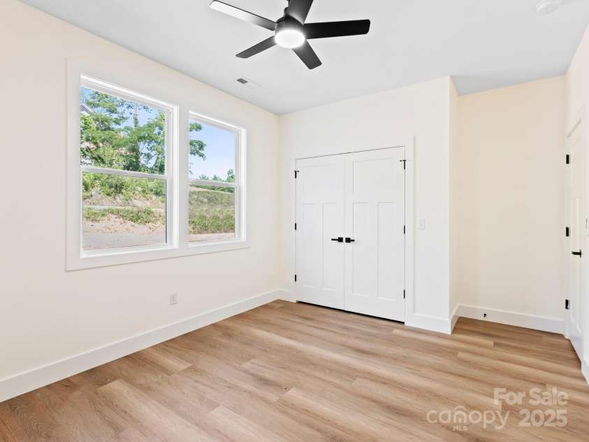 169 Vineyard Village Drive, Old Fort, NC 28762.  MLS# CAR4268925, YatesRealty ID 29376. Large double door closet has shelving already in place 