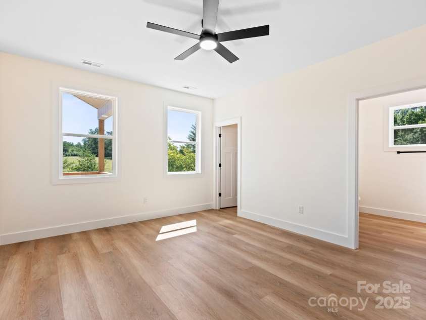 169 Vineyard Village Drive, Old Fort, NC 28762.  MLS# CAR4268925, YatesRealty ID 29376. The primary bedroom feels luxurious with a  walk in closet and on suite bathroom.  