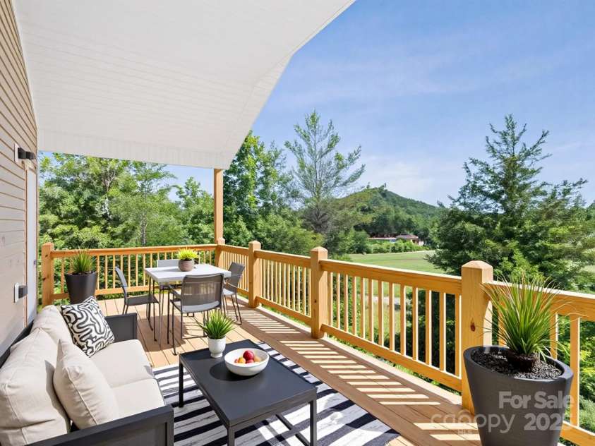 169 Vineyard Village Drive, Old Fort, NC 28762.  MLS# CAR4268925, YatesRealty ID 29376. Virtually staged outdoor deck space. 