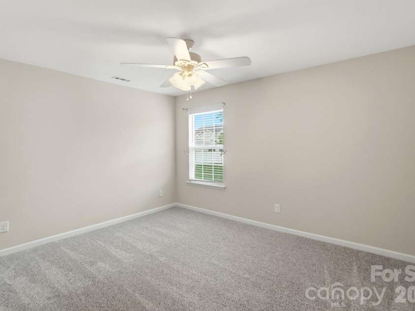 768 Bartram Avenue, Concord, NC 28025.  MLS# CAR4385709, YatesRealty ID 29377. Bedroom #2 faces the backyard.  Large closet and ceiling fan.