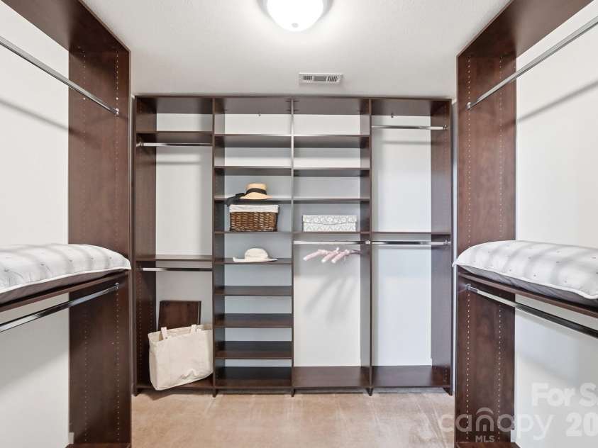 768 Bartram Avenue, Concord, NC 28025.  MLS# CAR4385709, YatesRealty ID 29377. This is an authentic, professionally designed, California Closet system with the most thought one could put in to a closet.  This closet has the perfect ratio of hanging and folded spaces.