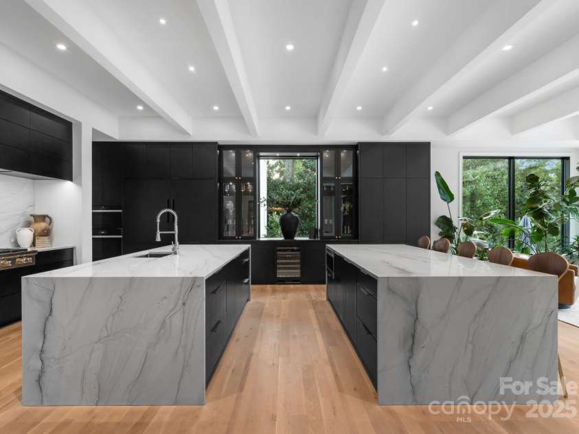 2116 Woodhaven Road, Charlotte, NC 28211.  MLS# CAR4186147, YatesRealty ID 2938. Double kitchen islands with waterfall quartzite
