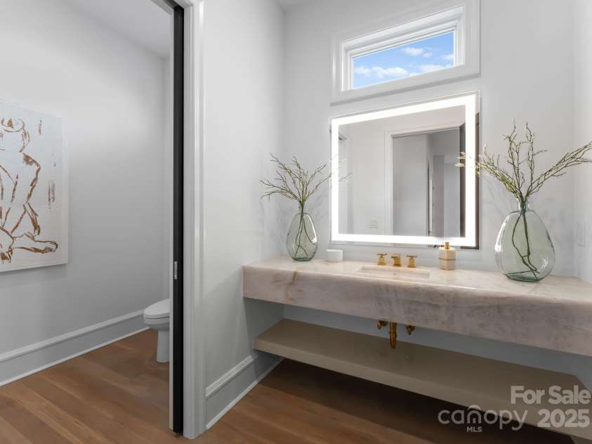 2116 Woodhaven Road, Charlotte, NC 28211.  MLS# CAR4186147, YatesRealty ID 2938. Main level powder room with floating marble sink