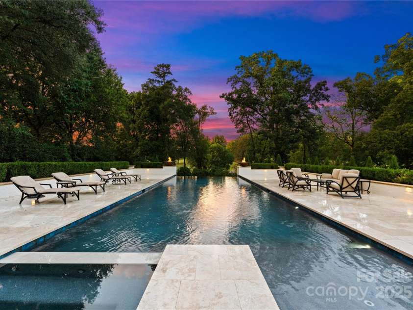 2116 Woodhaven Road, Charlotte, NC 28211.  MLS# CAR4186147, YatesRealty ID 2938. Oversized travertine pool deck with infinity edge pool