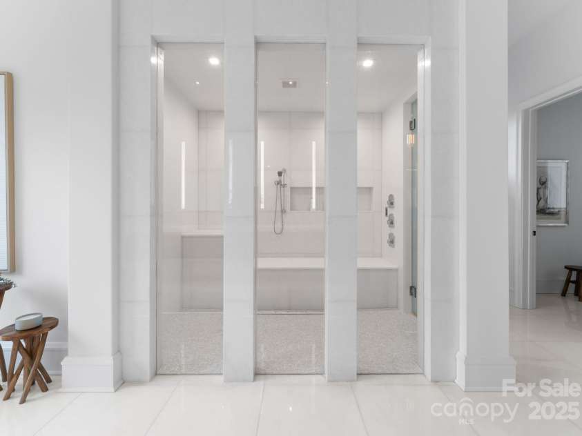 2116 Woodhaven Road, Charlotte, NC 28211.  MLS# CAR4186147, YatesRealty ID 2938. Primary steam shower and primary bathroom with marble heated tile floors