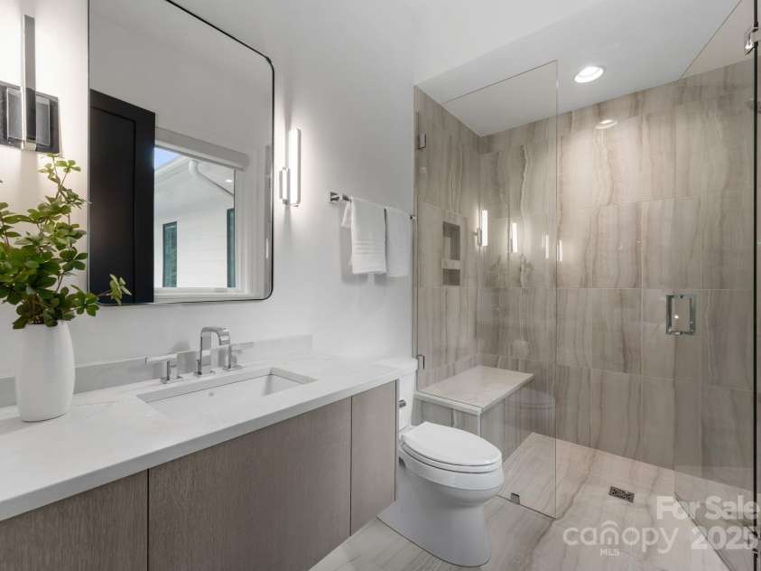 2116 Woodhaven Road, Charlotte, NC 28211.  MLS# CAR4186147, YatesRealty ID 2938. Upper level guest apartment bathroom