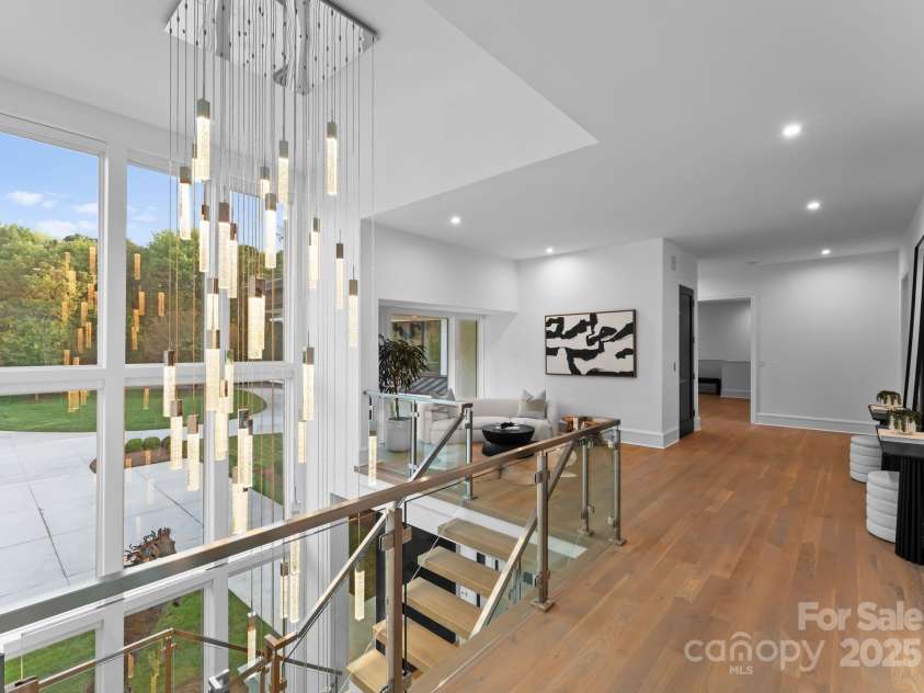 2116 Woodhaven Road, Charlotte, NC 28211.  MLS# CAR4186147, YatesRealty ID 2938. Upper level with 49 hanging pendant light that cascades to all three levels of the home