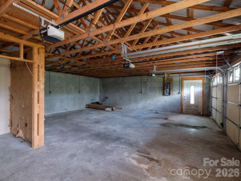 332 Island Cove Road, Penrose, NC 28766.  MLS# CAR4389646, YatesRealty ID 29406. Garage storage area