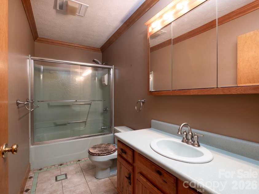 332 Island Cove Road, Penrose, NC 28766.  MLS# CAR4389646, YatesRealty ID 29406. Hall bathroom