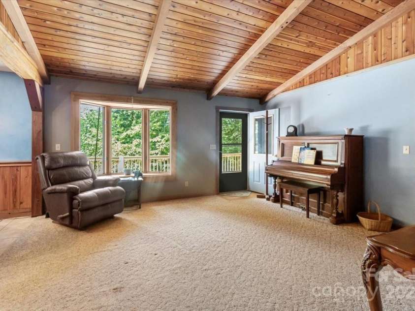 659 R B Deyton Road, Green Mountain, NC 28740.  MLS# CAR4284604, YatesRealty ID 29406. View from living room looking back toward front door.