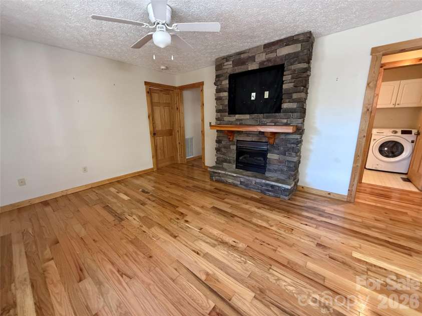 215 Pinellas Lane, Waynesville, NC 28785.  MLS# CAR4351510, YatesRealty ID 2941. Stone faced Fireplace