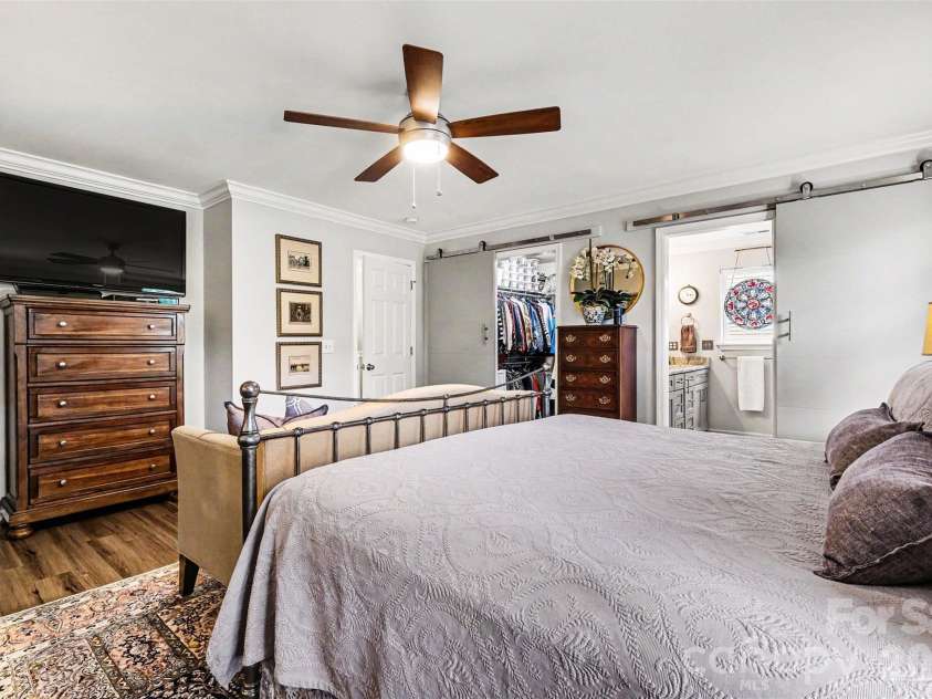 5520 Lemley Road, Concord, NC 28027.  MLS# CAR4388322, YatesRealty ID 29421. Primary bedroom with barn doors