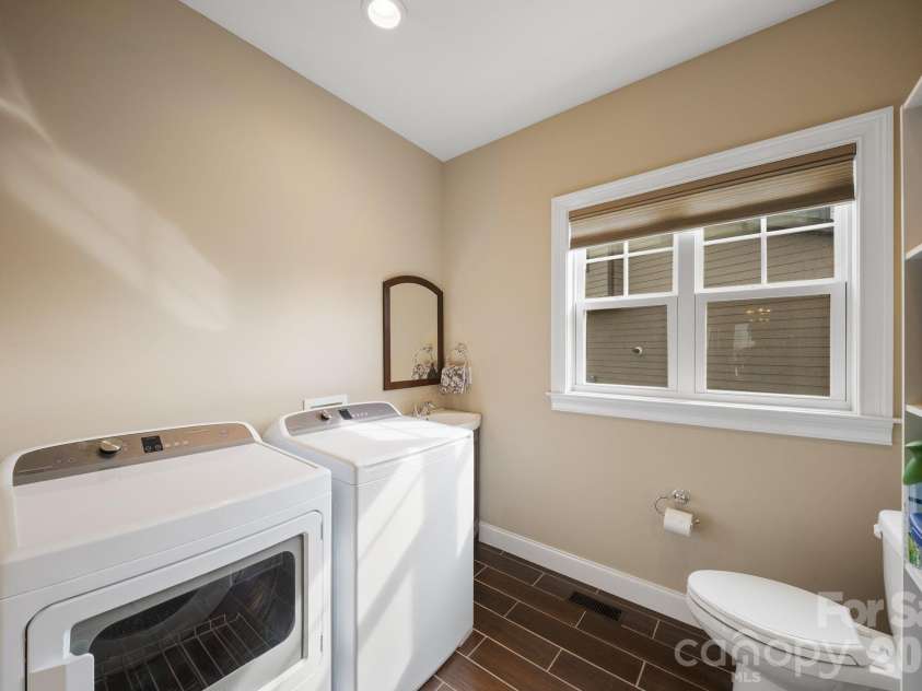 22 Asher Lane, Arden, NC 28704.  MLS# CAR4380408, YatesRealty ID 29433. Main floor laundry room and half bath